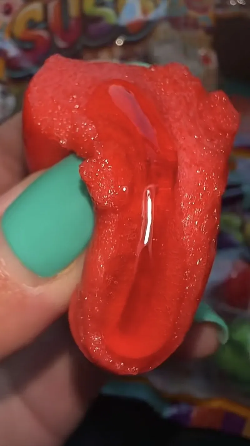 A shopper squeezing SUSO squeeze candy